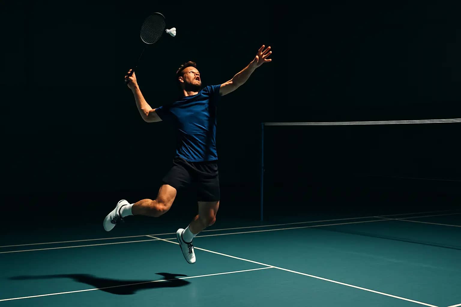 A badminton player mid-jump executing a powerful overhead smash on an indoor court